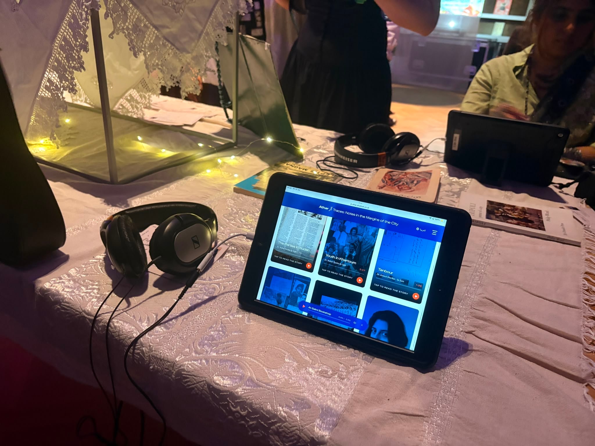 Athar’s digital archive displayed on a tablet beside headphones at the V&A.
